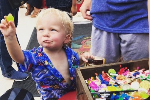 a small child sitting on a table