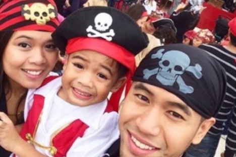 a little girl and her parents are dressed as pirates