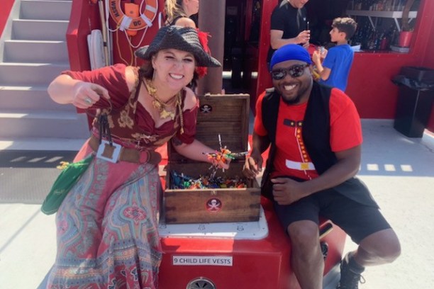 a little girl riding on the back of a truck