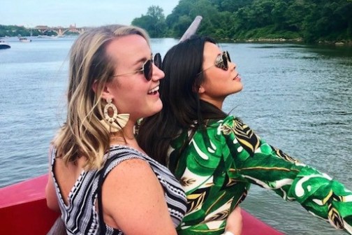 a person in a green boat on a body of water