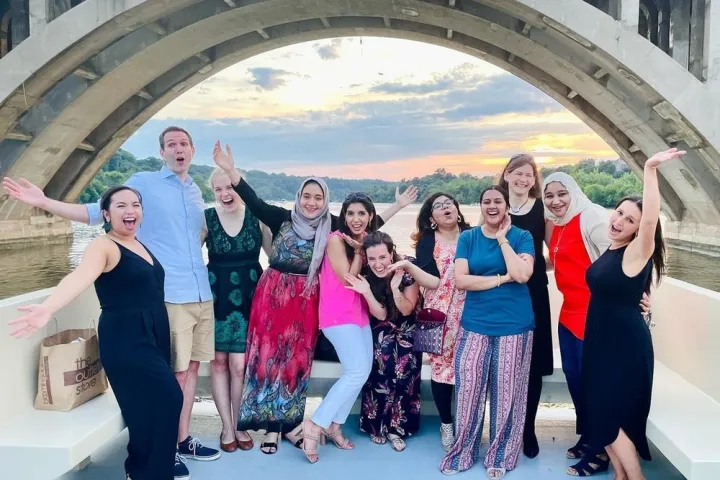 a group of people posing for a photo on a boat