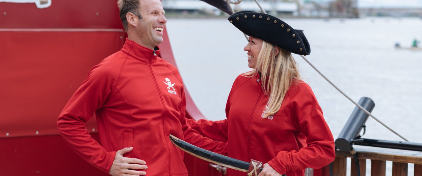 the owners of Boomerang Boat Tours on a pirate ship