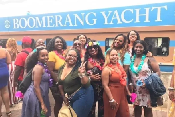 a group of people standing in front of a crowd posing for the camera